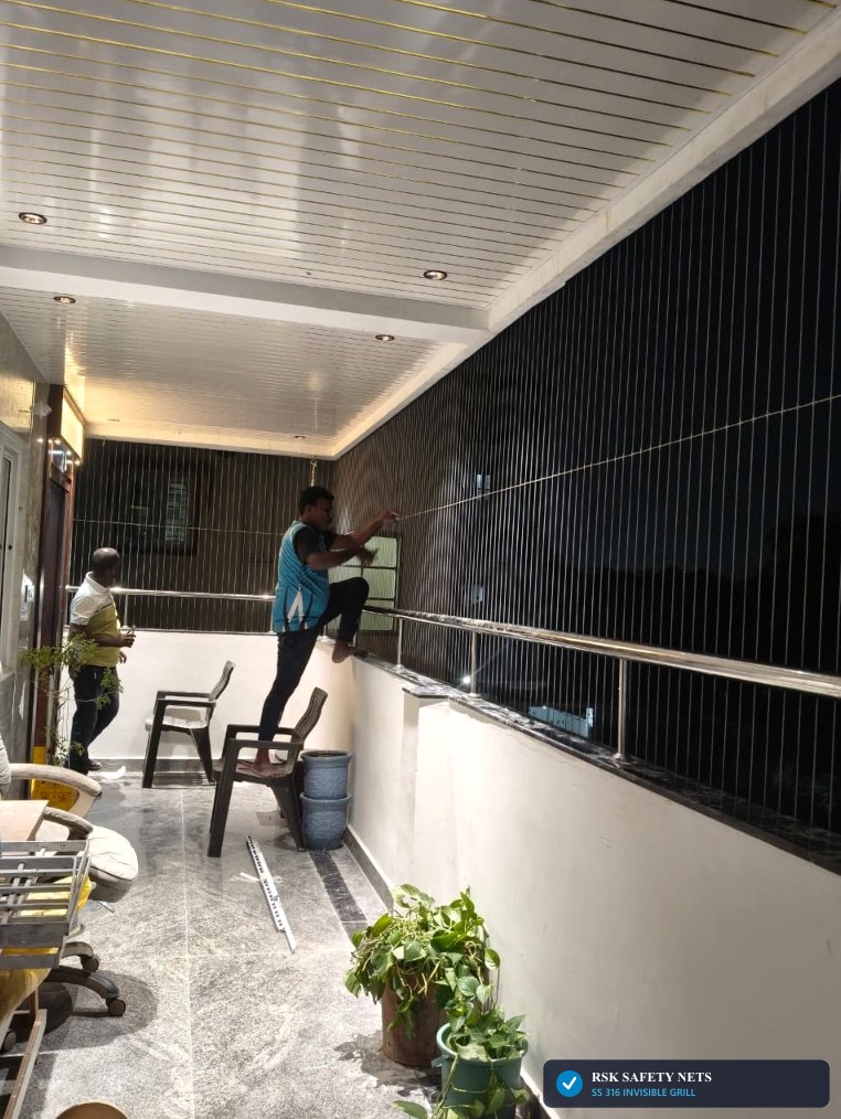 Certified RSK Technicians Installing SS 316 Balcony Invisible Grill